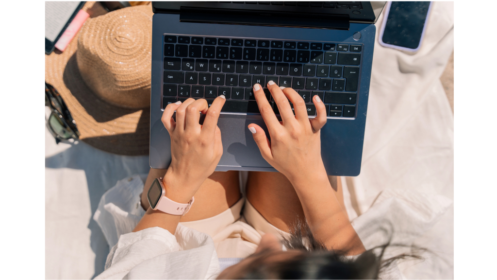 a woman using laptop to write